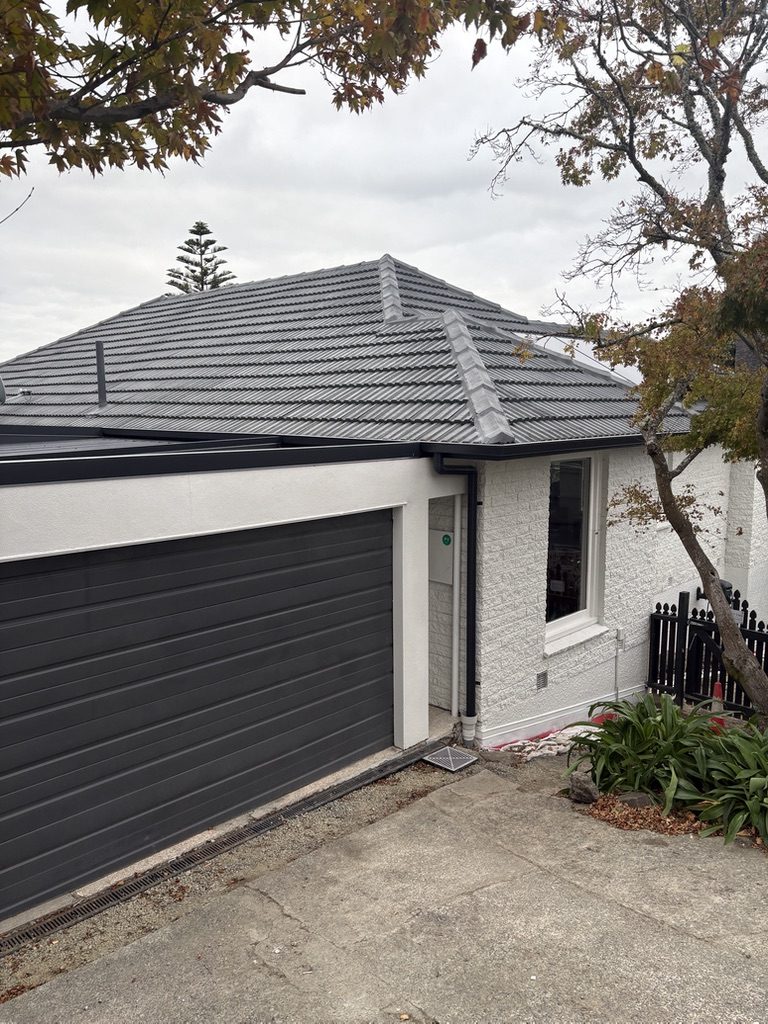Finished roofline with gutters and downpipe