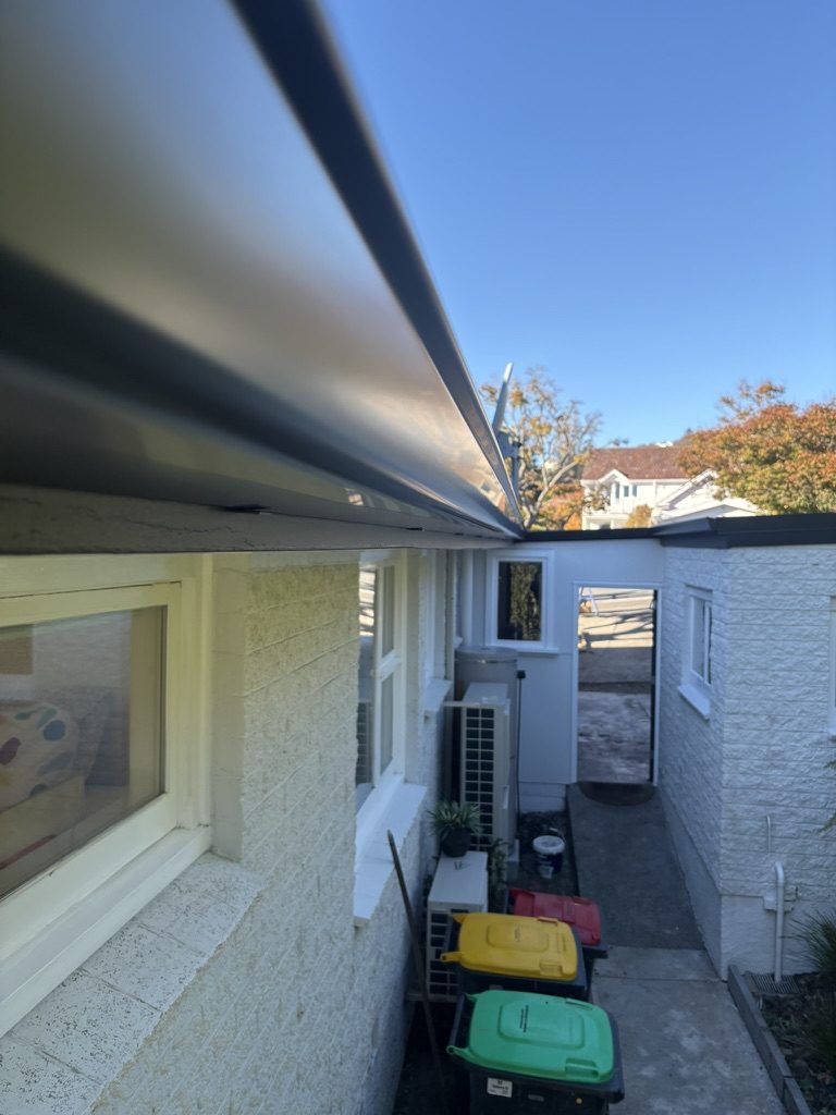 Close-up of newly installed metal guttering on a Canterbury home