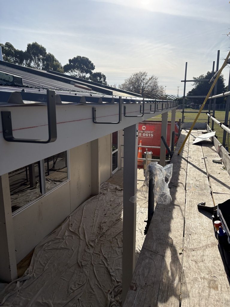 New gutter installation on a residential roofline